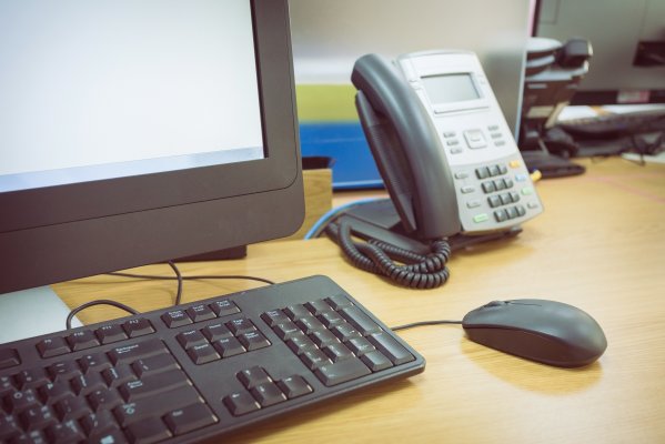 1-voip voip service voip phone computer monitor mouse keyboard phone on desk